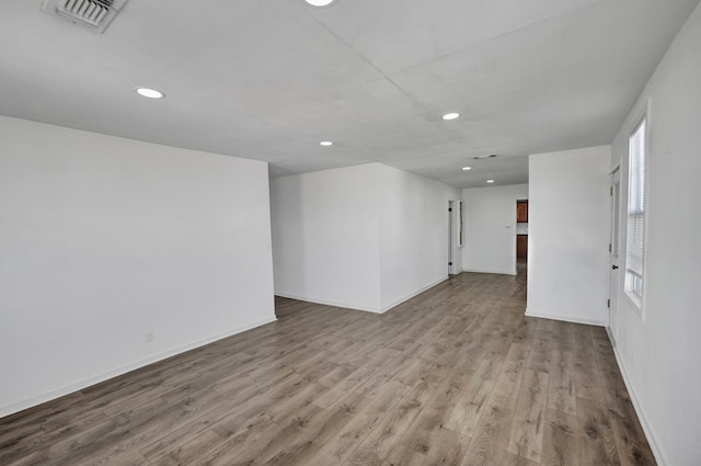 unfurnished room with light hardwood / wood-style floors