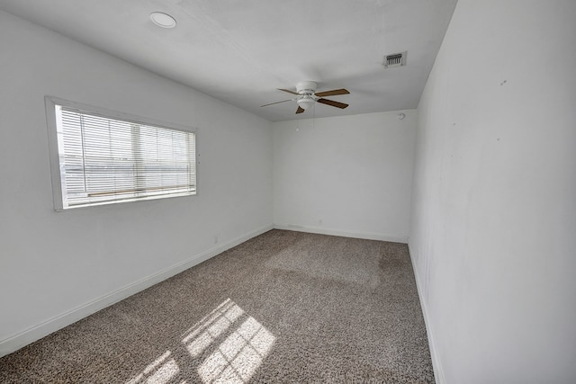 carpeted empty room featuring ceiling fan