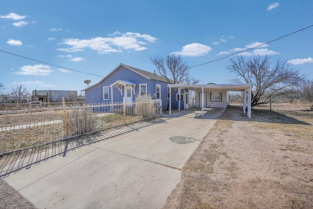 view of front of home with a carport