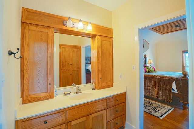 bathroom featuring vanity and wood-type flooring