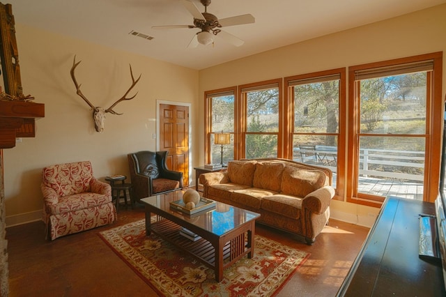 living room with a wealth of natural light and ceiling fan