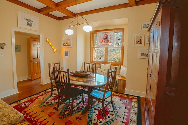 dining area with beamed ceiling, hardwood / wood-style flooring, and coffered ceiling