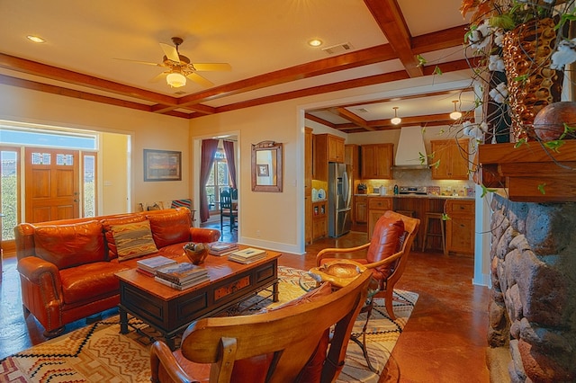 living room with beamed ceiling and ceiling fan