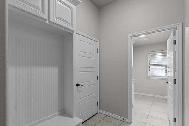 mudroom featuring light tile patterned flooring