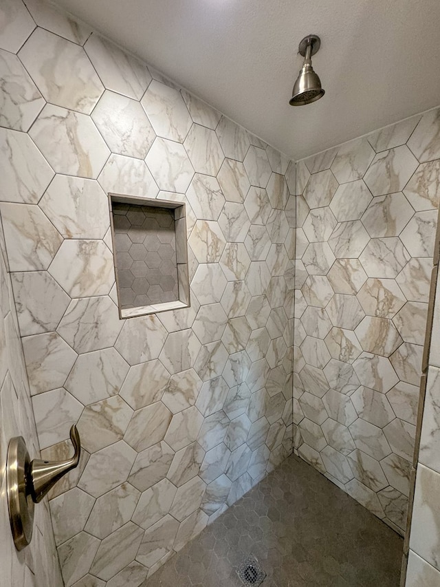 bathroom with tiled shower