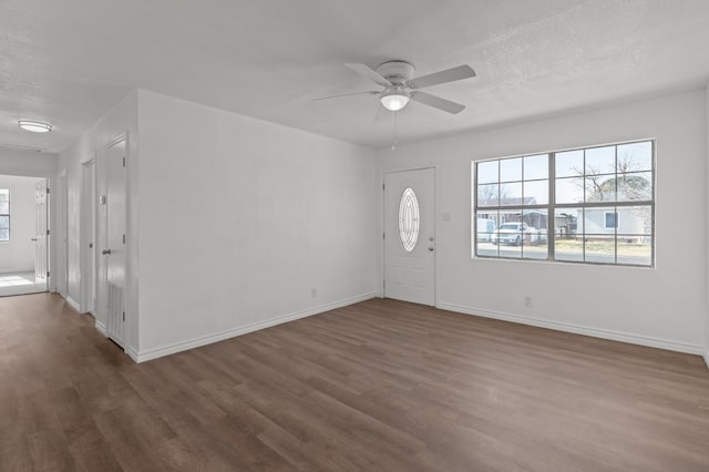 entrance foyer featuring ceiling fan, dark hardwood / wood-style floors, and a textured ceiling