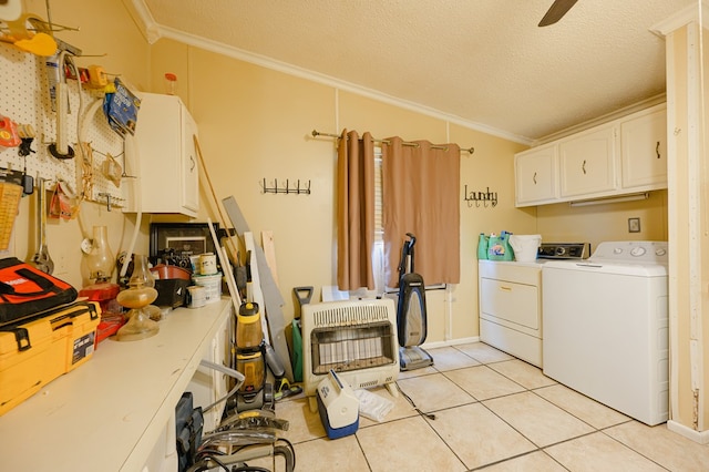 laundry area featuring cabinets, a workshop area, heating unit, washer and dryer, and ornamental molding