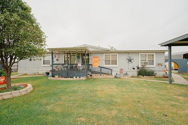 view of front of house with cooling unit and a front yard