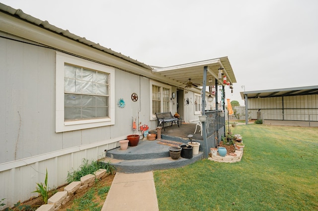 view of exterior entry with a lawn