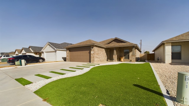 view of front facade featuring a front yard and a garage