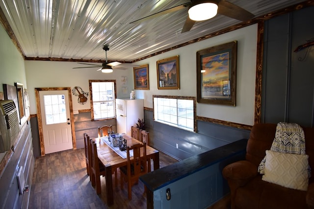 dining room with wooden ceiling, dark hardwood / wood-style floors, and ornamental molding