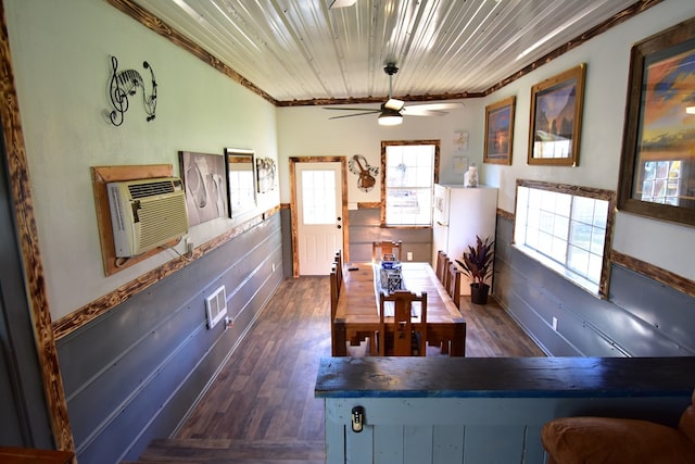 dining room with ceiling fan, wooden ceiling, dark hardwood / wood-style floors, an AC wall unit, and ornamental molding