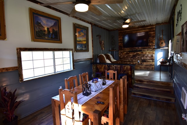 dining area with dark hardwood / wood-style flooring and wood ceiling