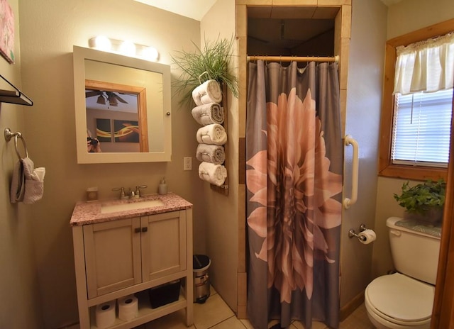 bathroom with tile patterned floors, walk in shower, vanity, and toilet