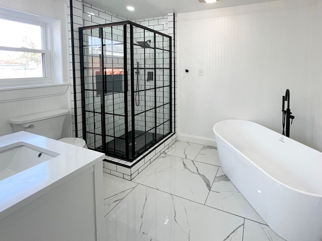 bathroom with toilet, vanity, a freestanding bath, marble finish floor, and a shower stall