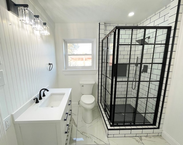 full bathroom featuring baseboards, toilet, marble finish floor, vanity, and a shower stall