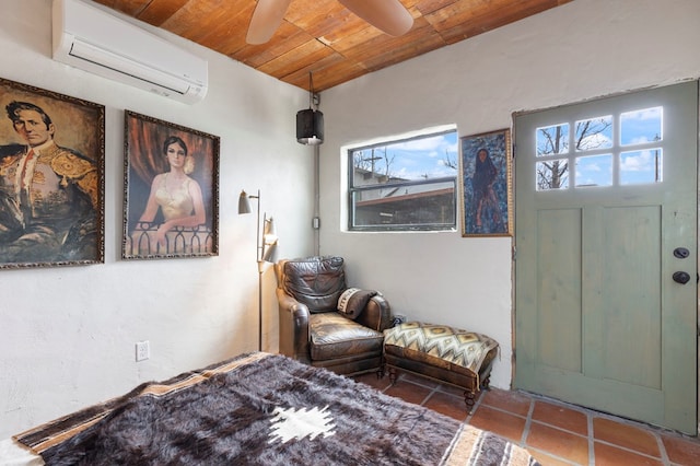 interior space featuring ceiling fan, tile patterned flooring, wood ceiling, and a wall mounted air conditioner