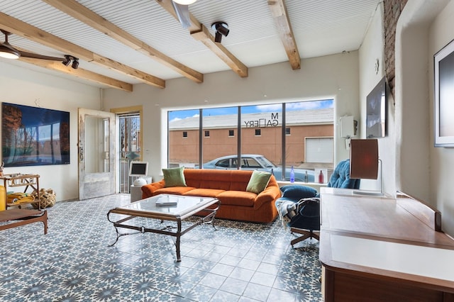 living room with beamed ceiling