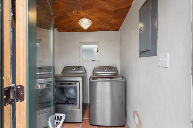 washroom featuring light tile patterned floors, independent washer and dryer, and electric panel