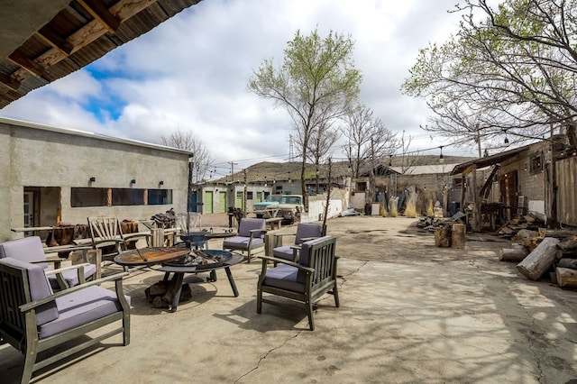 view of patio with a fire pit