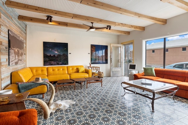 living room with beamed ceiling and ceiling fan