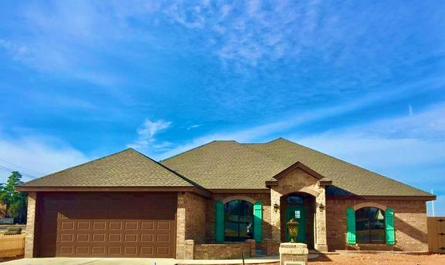 french provincial home featuring a garage