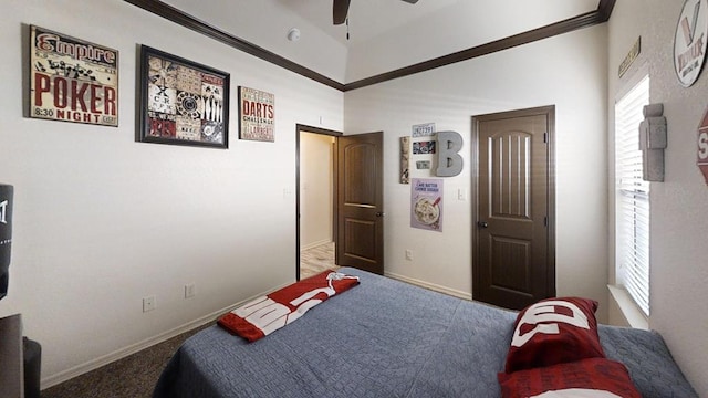 bedroom featuring ceiling fan, carpet floors, ornamental molding, and multiple windows