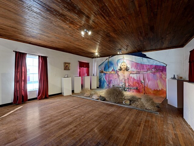 interior space with wood ceiling, lofted ceiling, and hardwood / wood-style flooring