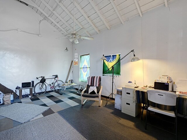 exercise room featuring ceiling fan, wood ceiling, and high vaulted ceiling