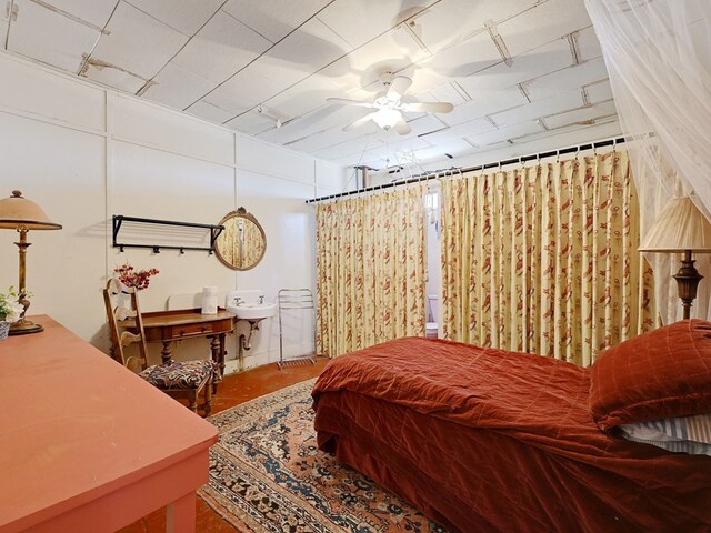 bedroom featuring concrete floors and ceiling fan