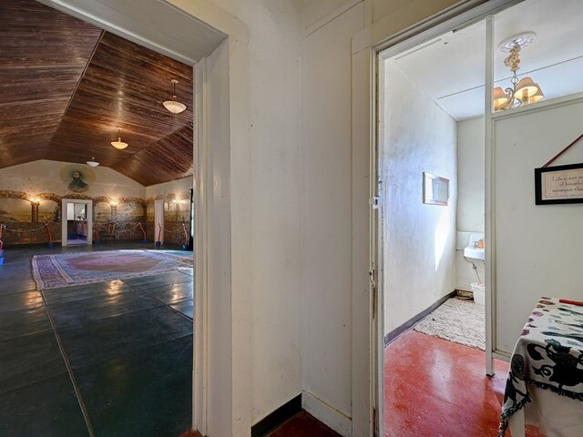 interior space with wood ceiling and lofted ceiling