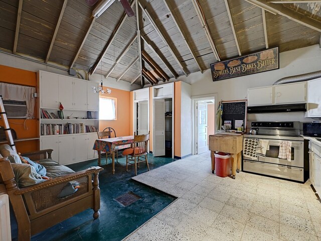 kitchen featuring stainless steel range with electric stovetop, white cabinets, beamed ceiling, and high vaulted ceiling