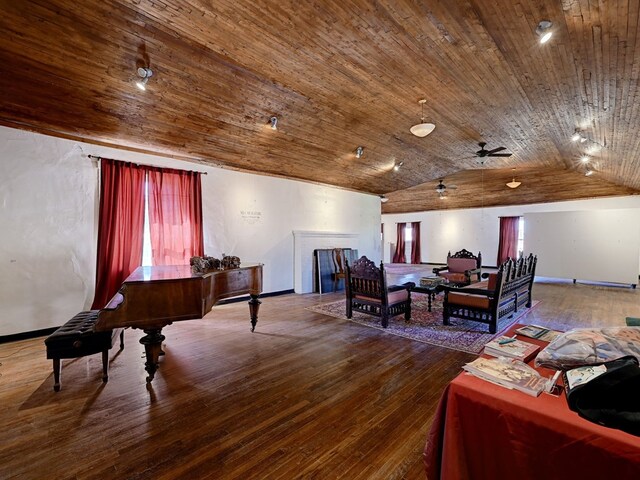 interior space featuring hardwood / wood-style floors, vaulted ceiling, ceiling fan, and wood ceiling