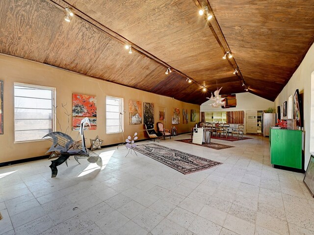 unfurnished bedroom featuring stainless steel fridge, track lighting, wood ceiling, and lofted ceiling