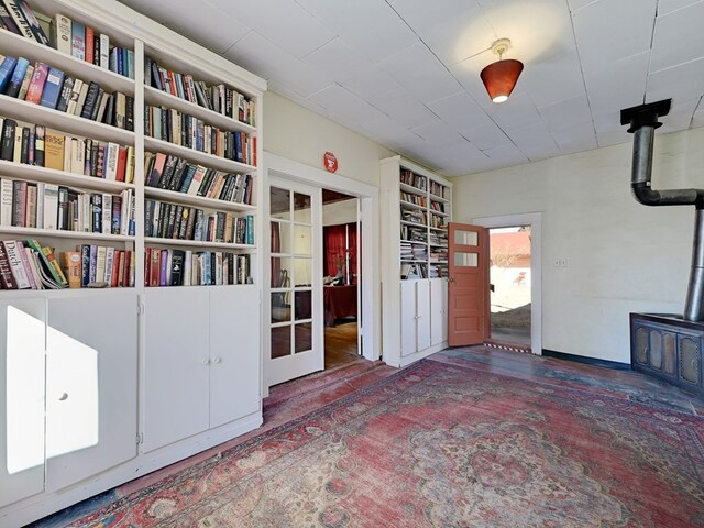 interior space with built in features and a wood stove