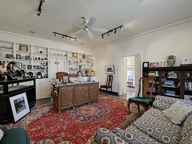 living room featuring ceiling fan, built in features, and rail lighting