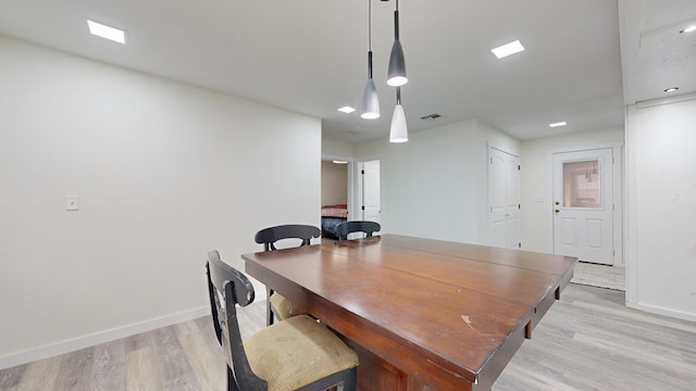 dining area with light wood-type flooring