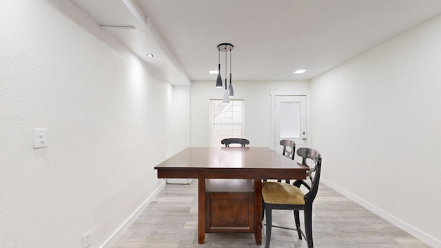 dining space featuring light wood-type flooring