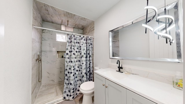 bathroom with vanity, toilet, and walk in shower