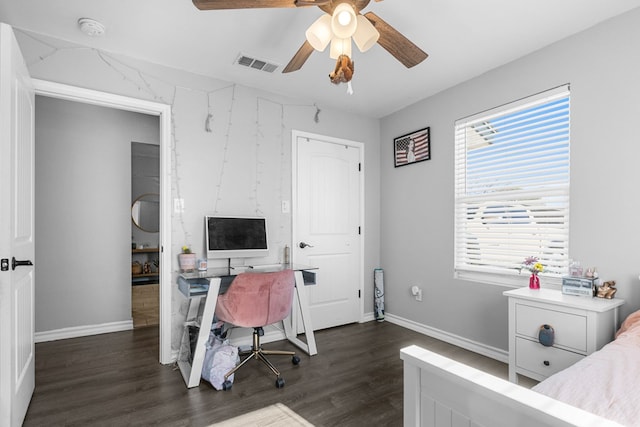 interior space featuring dark wood-type flooring and ceiling fan