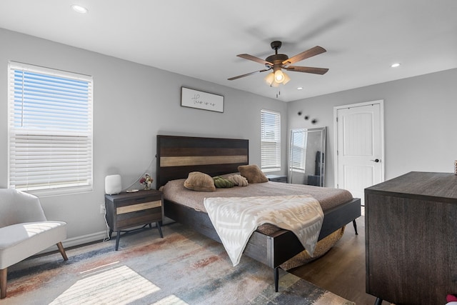 bedroom featuring ceiling fan and hardwood / wood-style floors