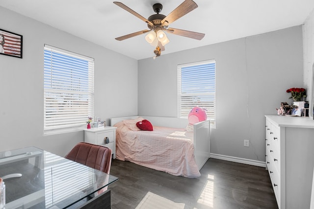 bedroom featuring dark wood-type flooring and ceiling fan