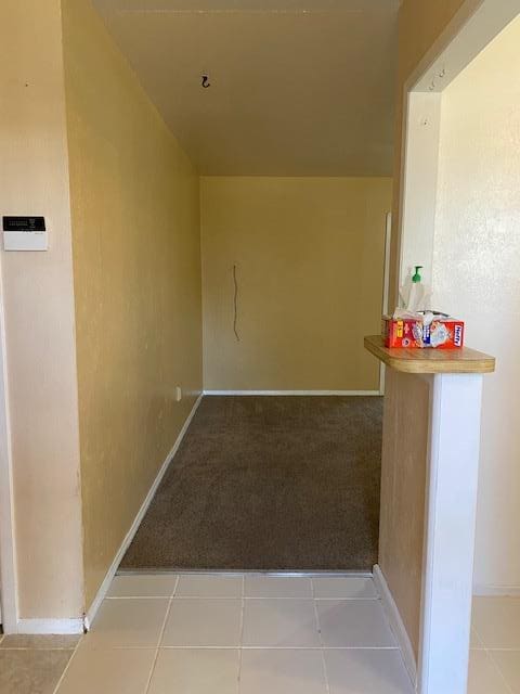 interior space with light tile patterned floors