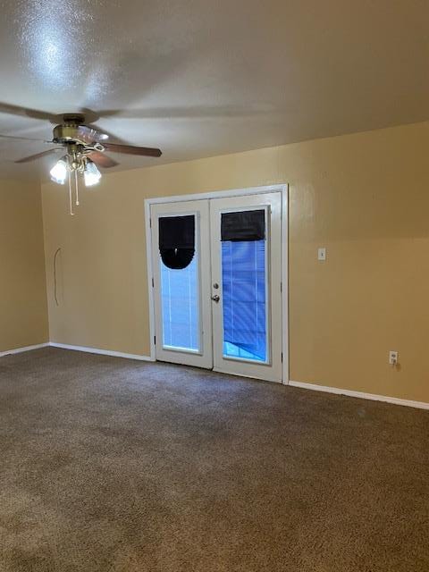 unfurnished room featuring ceiling fan, carpet flooring, a textured ceiling, and french doors