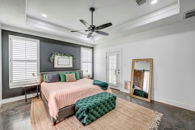 bedroom featuring access to exterior, a raised ceiling, and ceiling fan