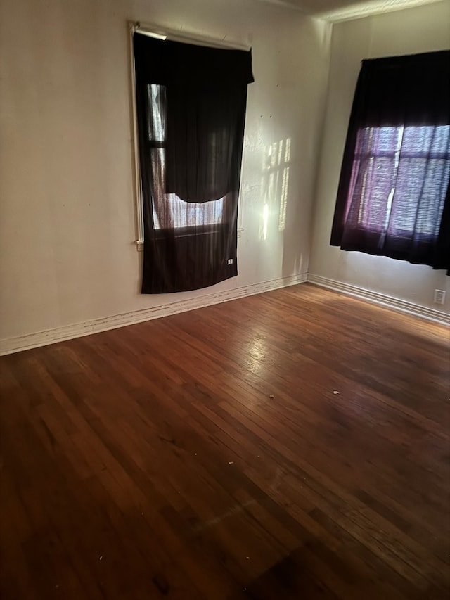 spare room featuring dark hardwood / wood-style floors