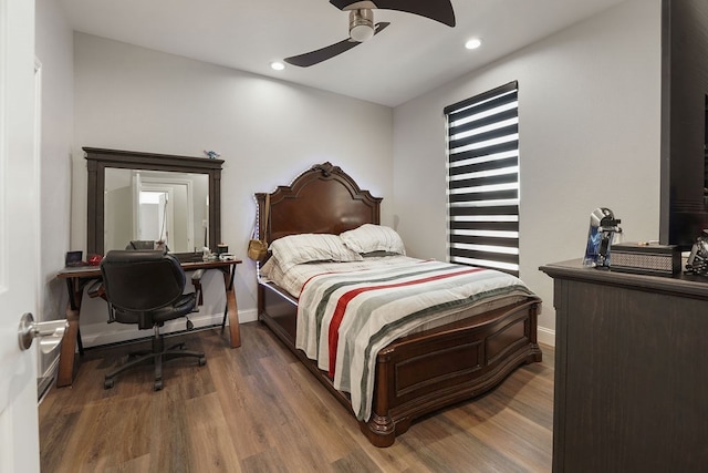 bedroom featuring ceiling fan and dark wood-type flooring