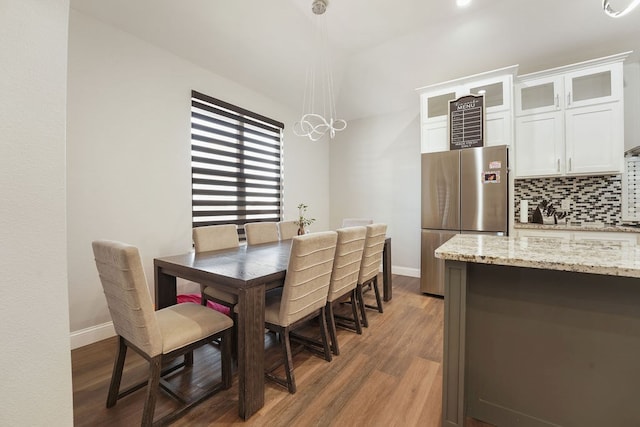 dining area featuring dark hardwood / wood-style floors