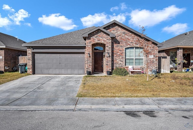 view of front of house with a front yard and a garage