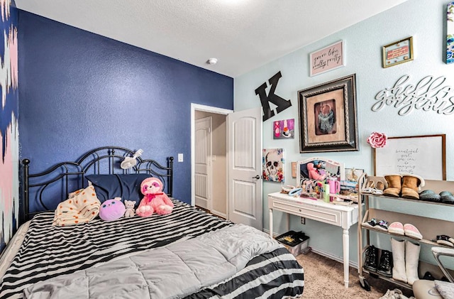 bedroom with carpet and a textured ceiling